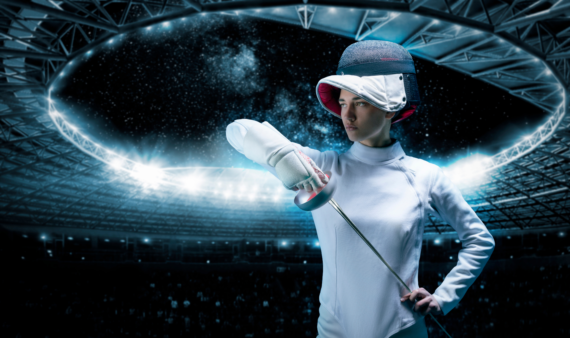 Fencer posed in a stadium with foil extended